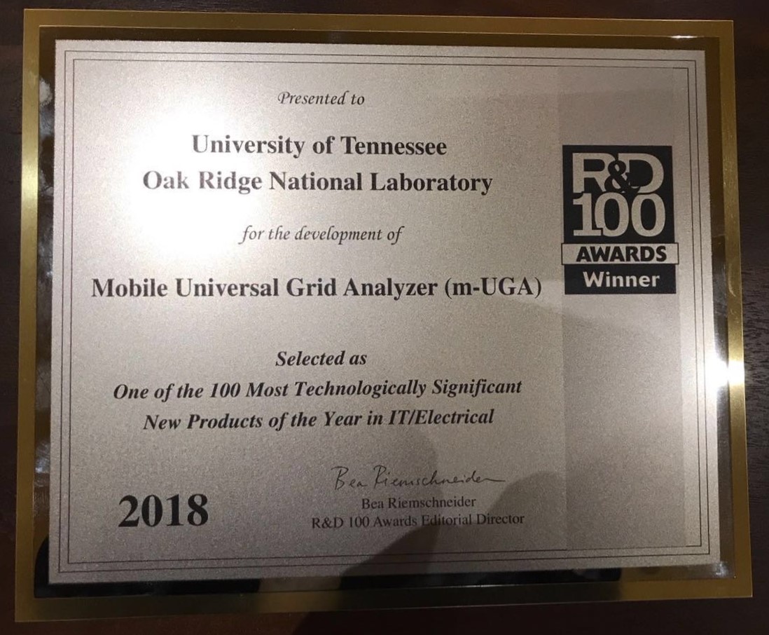 Picture of the 2018 R&D 100 Award Plaque for the Mobile Universal Grid Analyzer (m-UGA)